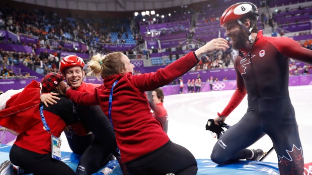 Dion and Hamelin celebrate, The Canadian Press Dion and Hamelin celebrate