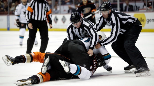 Refs break up John Scott fight, The Canadian Press Refs break up John Scott fight