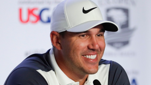 Brooks Koepka smiles during Tuesday's U.S. Open news conference.