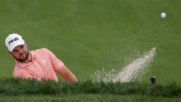 Corey Conners hits from a bunker during the BMW Championship.