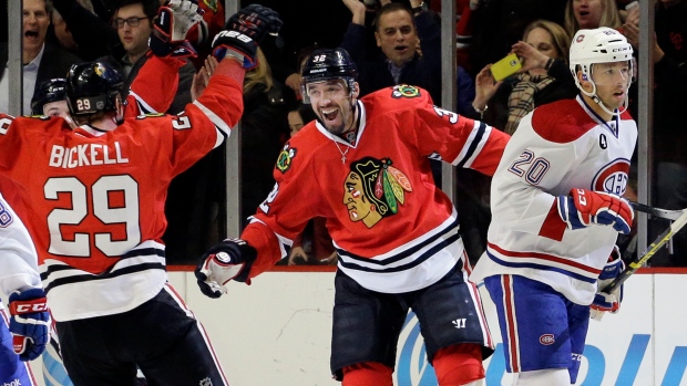 Rozsival, Bickell celebrate, The Canadian Press Rozsival, Bickell celebrate