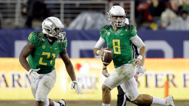 Mariota and Freeman, The Canadian Press Mariota and Freeman