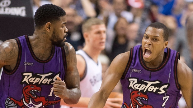 Kyle Lowry and Amir Johnson, The Canadian Press Kyle Lowry and Amir Johnson