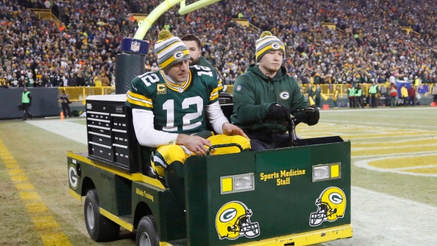 Aaron Rodgers carted off