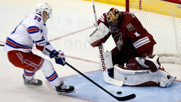 Chris Kreider scores on Mike Smith, The Canadian Press Chris Kreider scores on Mike Smith