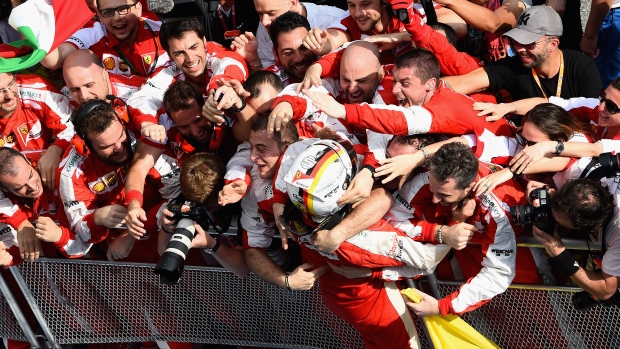 Sebastian Vettel celebrates with team, Getty Images/Getty Images Sebastian Vettel celebrates with team