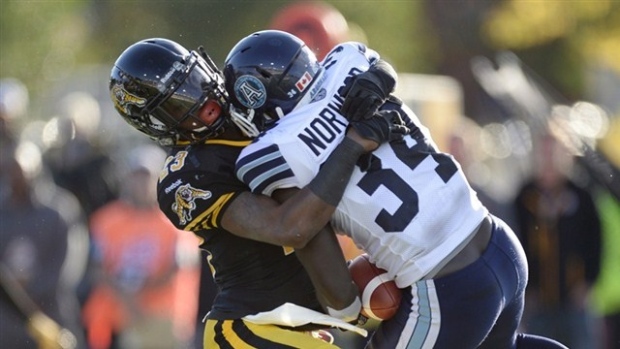 Brandon Isaac and Jerious Norwood , The Canadian Press Brandon Isaac and Jerious Norwood
