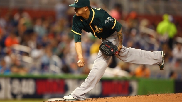 Athletics benefit from replay reversal and score 4 in 9th off Cishek to beat Marlins 9-5 Article Image 0