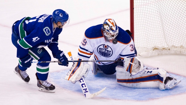 Oilers Anders Nilsson Canucks Sven Baertschi, The Canadian Press Oilers Anders Nilsson Canucks Sven Baertschi