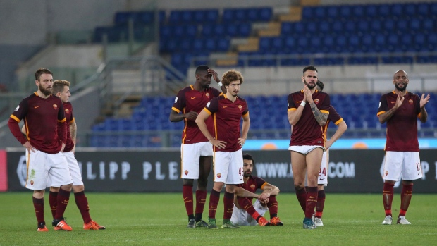 A dejected Roma, The Canadian Press A dejected Roma