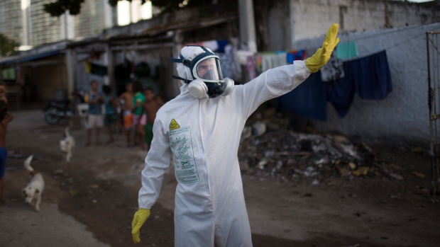 A municipal worker gestures during an operation to combat the Aedes aegypti mosquitoes that transmit