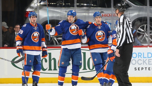 Islanders celebrate, Mike Stobe/National Hockey League/Getty Images Islanders celebrate