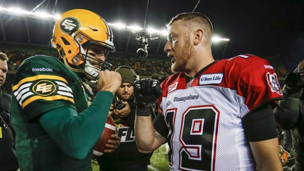 MIke Reilly & Bo Levi Mitchell shake hands