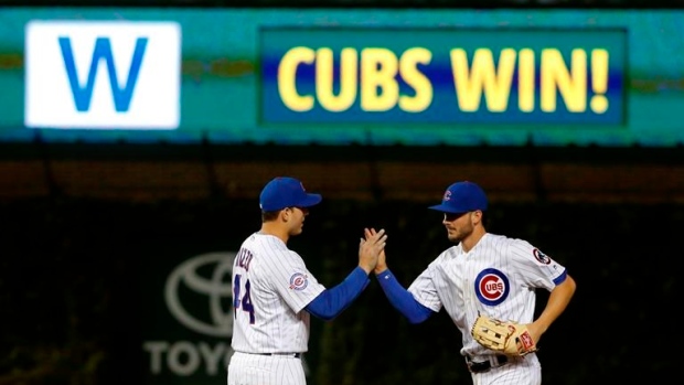 Rizzo, Bryant celebrate, The Canadian Press Rizzo, Bryant celebrate