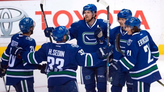 Canucks players celebrate