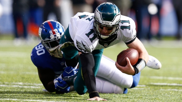 Jason Pierre-Paul tackles Carson Wentz, Jeff Zelevansky/Getty Images Jason Pierre-Paul tackles Carson Wentz