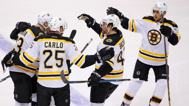 Bruins players celebrate, The Canadian Press Bruins players celebrate