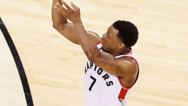 Kyle Lowry shoots over J.R. Smith