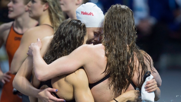 Penny Oleksiak and Canadian swim team