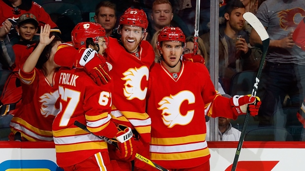 Dougie Hamilton Mikael Backlund, Gerry Thomas/National Hockey League/Getty Images Dougie Hamilton Mikael Backlund