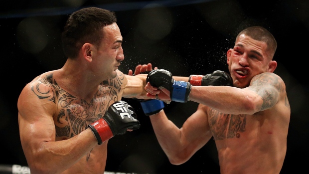 Max Holloway punches Anthony Pettis