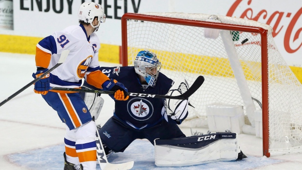 John Tavares Connor Hellebuyck, The Canadian Press John Tavares Connor Hellebuyck