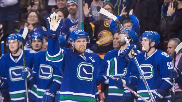 Henrik Sedin celebrates 1,000th point