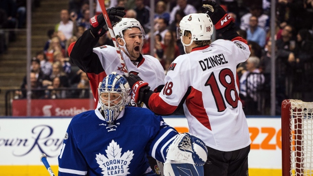 Stone, Dzingel celebrate, The Canadian Press Stone, Dzingel celebrate