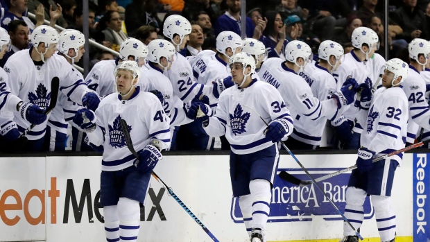 Komarov, Matthews and Leivo celebrate