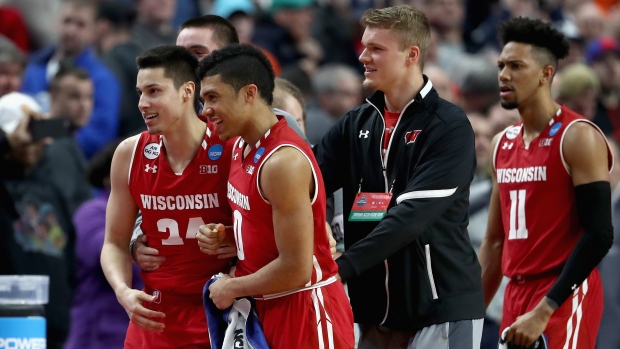 Wisconsin celebrates, Elsa/Getty Images Wisconsin celebrates