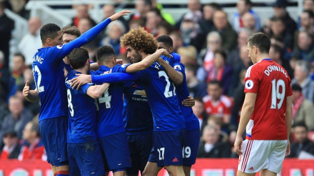 Marouane Fellaini and Manchester United Celebrates, The Canadian Press Marouane Fellaini and Manchester United Celebrates
