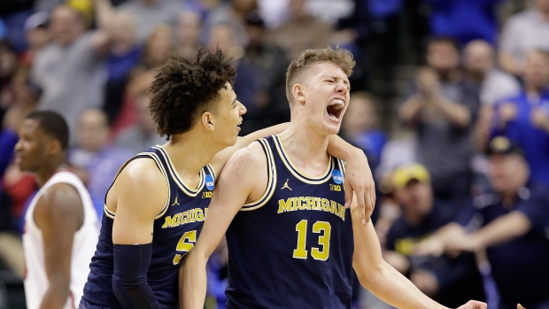 D.J. Wilson and Moritz Wagner, Andy Lyons/Getty Images D.J. Wilson and Moritz Wagner