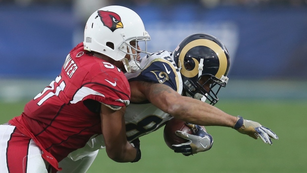 Kevin Minter tackles Lance Kendricks, Stephen Dunn/Getty Images Kevin Minter tackles Lance Kendricks