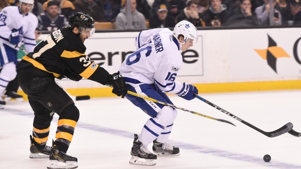 Patrice Bergeron chases Mitch Marner