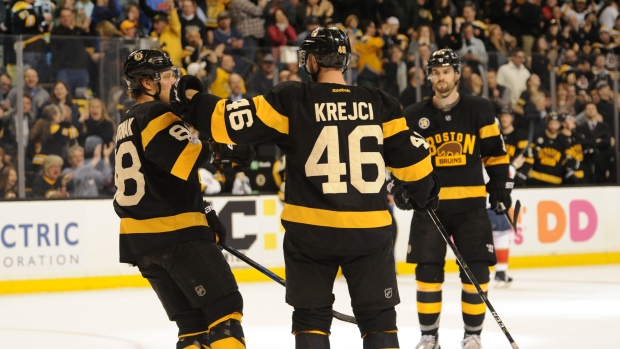Bruins celebrate, Steve Babineau/National Hockey League/Getty Images Bruins celebrate