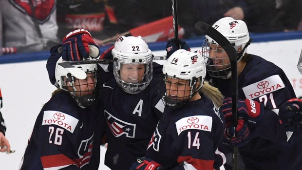 Team USA celebrates, the Canadian press Team USA celebrates