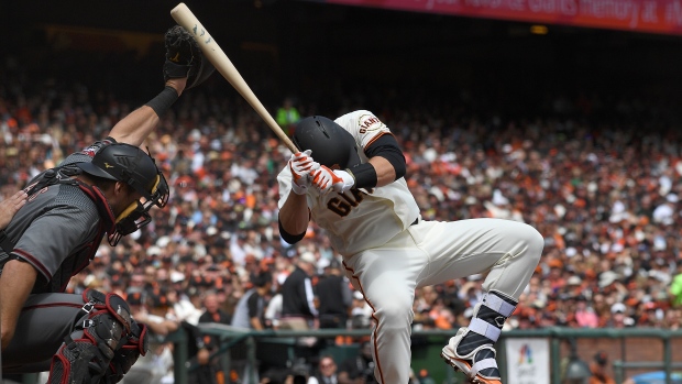 Buster Posey is hit by a pitch