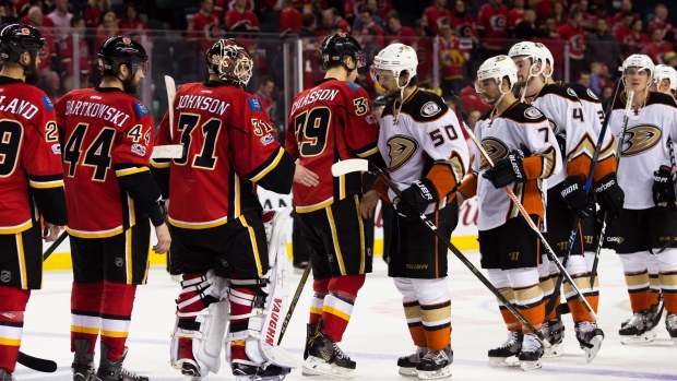 Anaheim Ducks and Calgary Flames shake hands