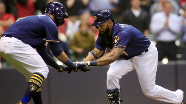 Jonathan Villar and Eric Thames celebrate