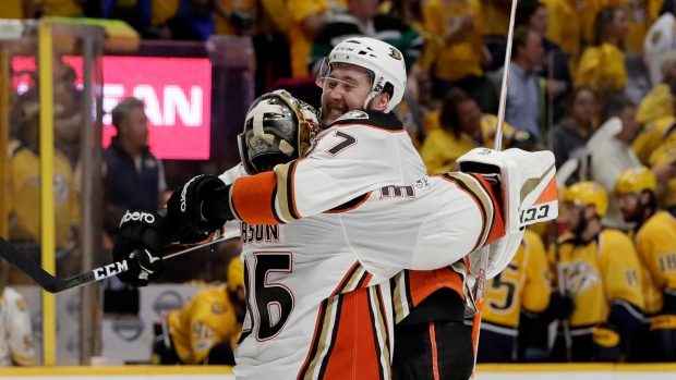 John Gibson and Andrew Cogliano celebrate victory