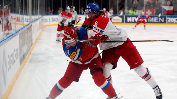 Sulak checks Panarin, The Canadian Press Sulak checks Panarin