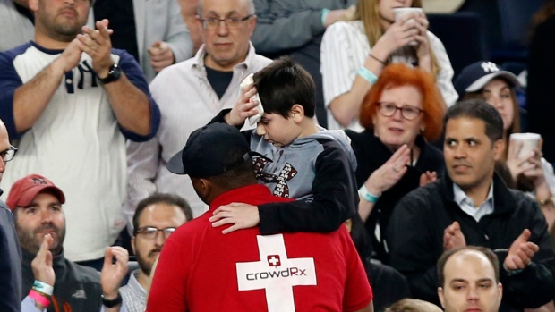 The boy pictured was hit in the head by a piece of New York Yankees's Chris Carter's bat 
