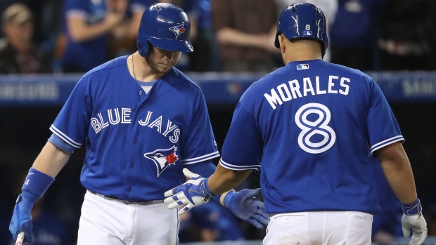 Kendrys Morales and Justin Smoak, Tom Szczerbowski/Getty Images Kendrys Morales and Justin Smoak
