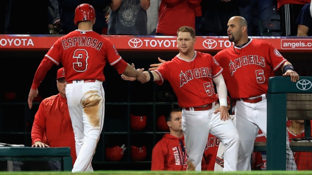 Danny Espinosa congratulated by Kole Calhourn and Albert Pujols