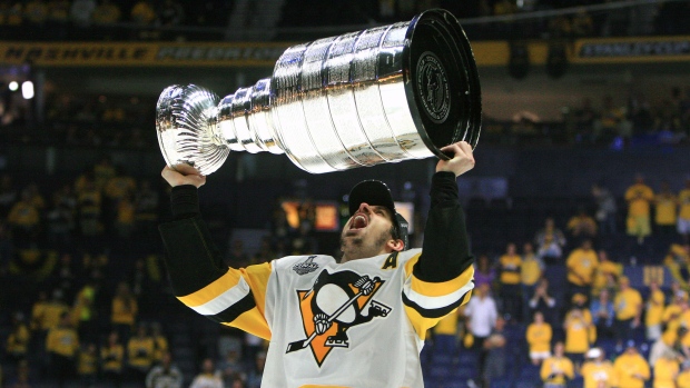 Evgeni Malkin hoists the Stanley Cup