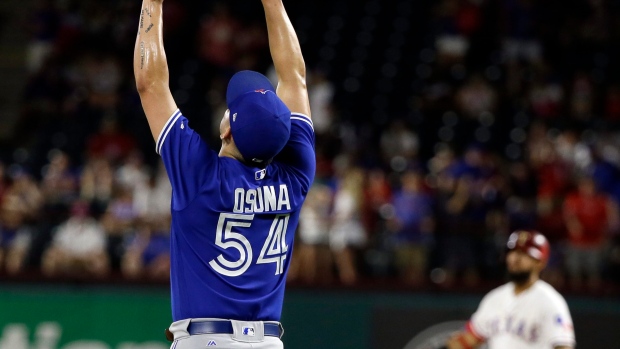 Roberto Osuna celebrates