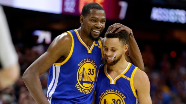 Kevin Durant hugs Steph Curry