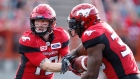 Bo Levi Mitchell hands to Jerome Messam