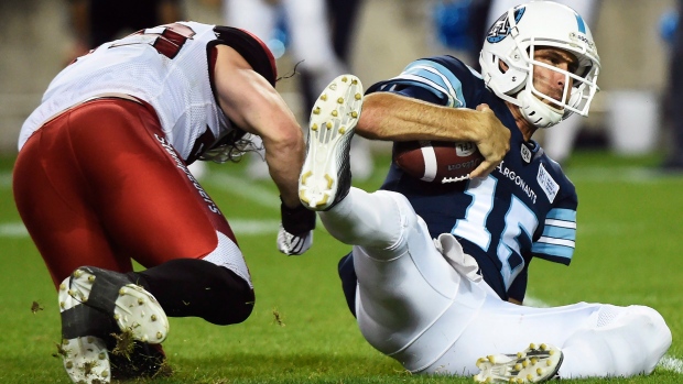 Ricky Ray and Alex Singleton, The Canadian Press Ricky Ray and Alex Singleton