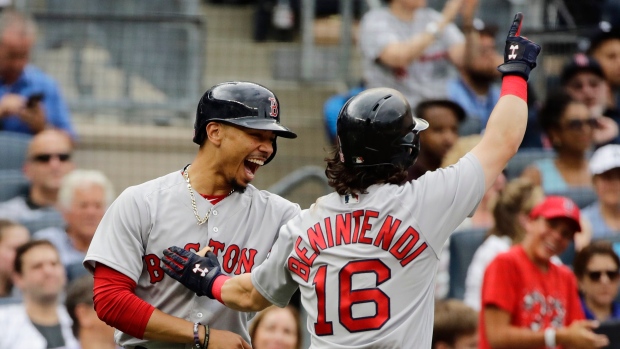 Mookie Betts and Andrew Benintendi , The Canadian Press Mookie Betts and Andrew Benintendi